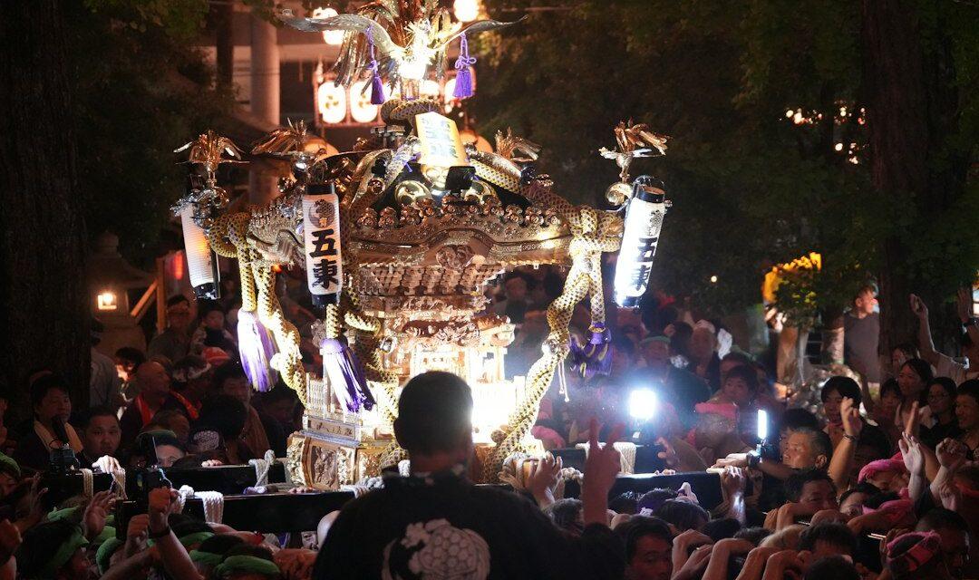 Illuminated Japanese festival float at night