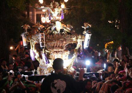 Illuminated Japanese festival float at night