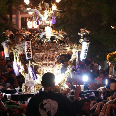 Illuminated Japanese festival float at night
