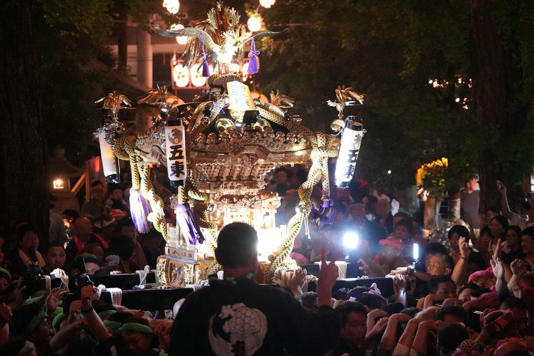 Illuminated Japanese festival float at night